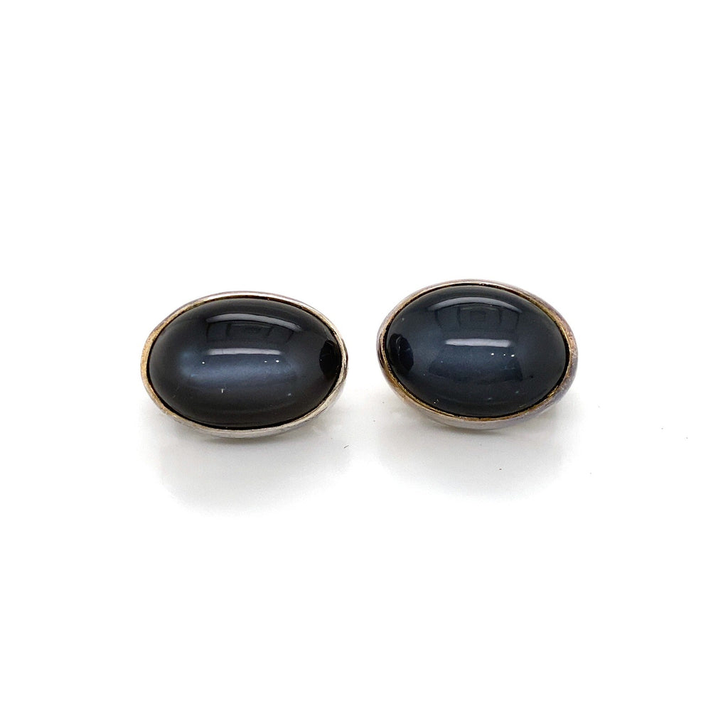Stephen Dweck silver clip earrings with oval cabochon black Diopside stone. (view 1)