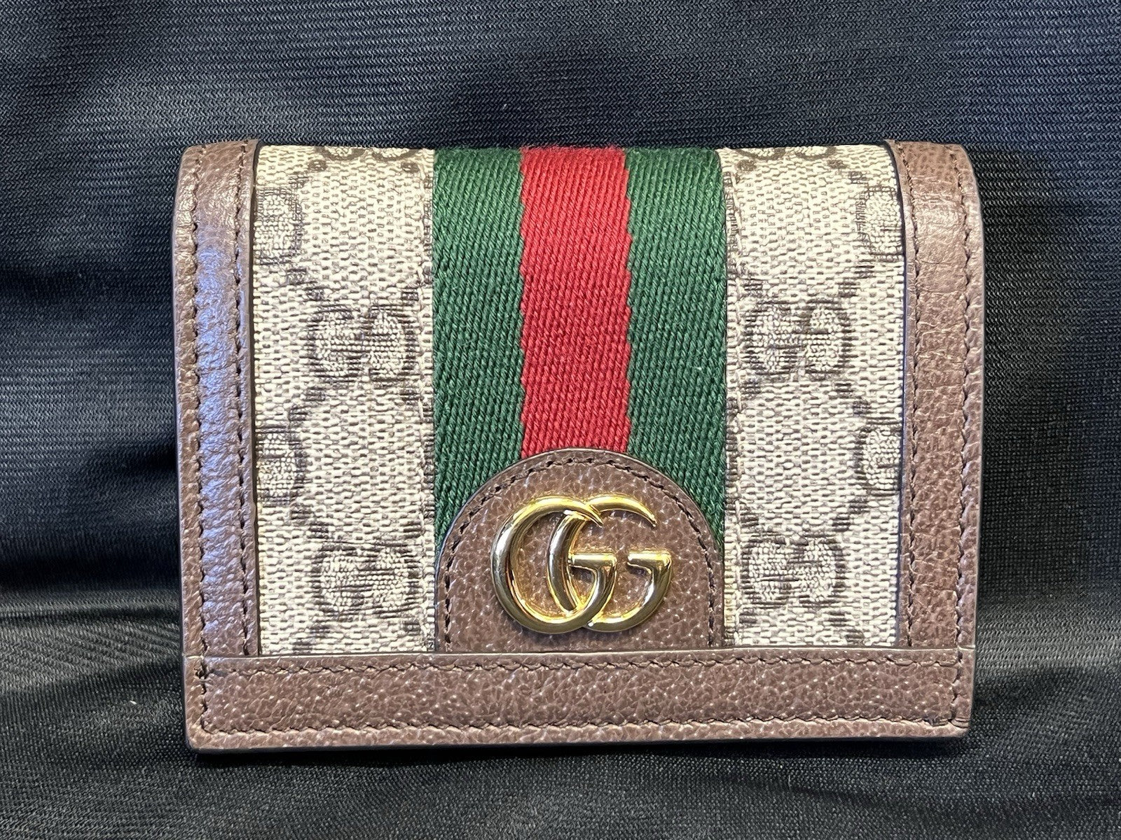 GUCCI OPHIDIA GG SUPREME CANVAS AND LEATHER COMPACT WALLET0