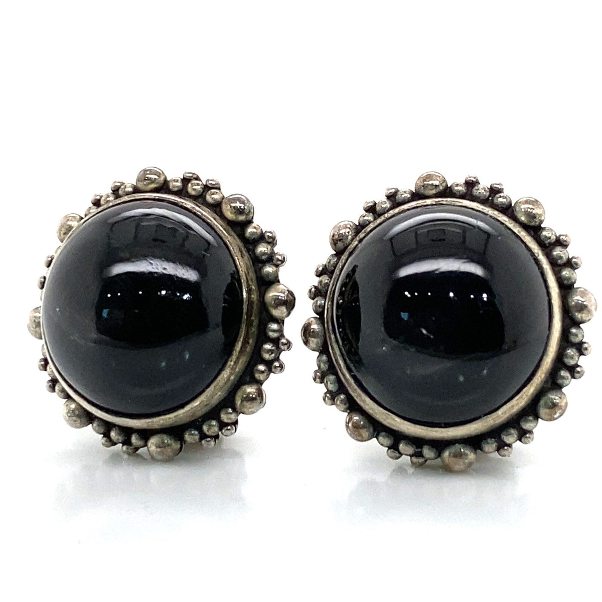 Stephen Dweck silver earrings w/ round black Star Diopside cabochon, clip backs. (view 1)